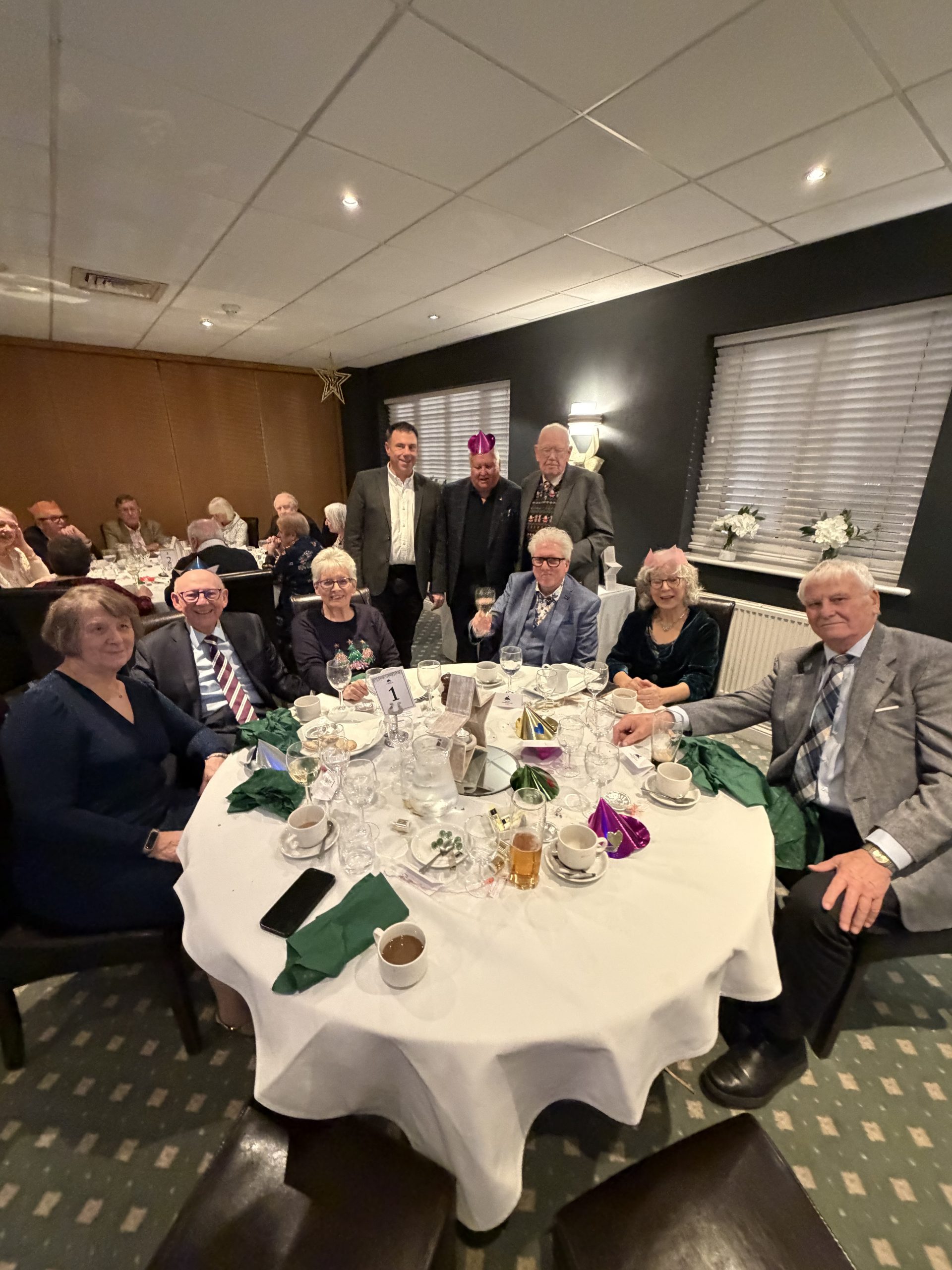 Members, partners and guests around the table at the lodge Christmas dinner